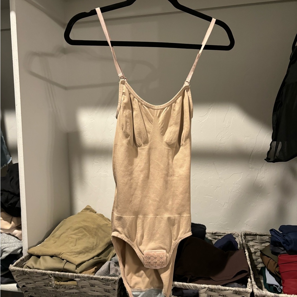 NEVER WORN. Frame/body sculpting bodysuit